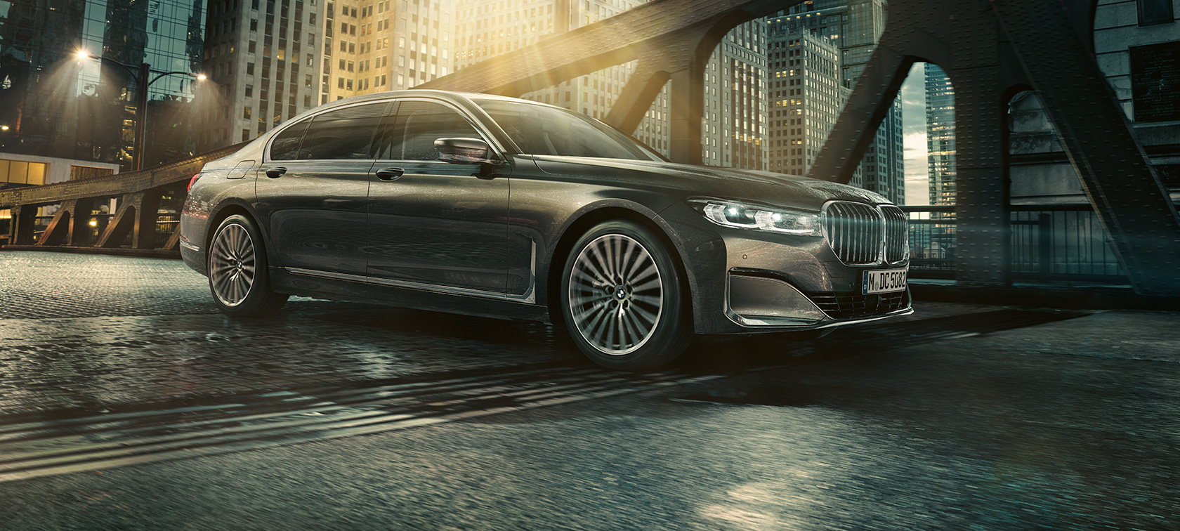 BMW 7 Series Sedan G11 G12 2019 Bernina Grey Amber Effect in urban setting three-quarter side view